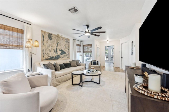 3405 Barksdale Dr, Austin, TX 78725 - living room with ceiling fan and light wood-style floors