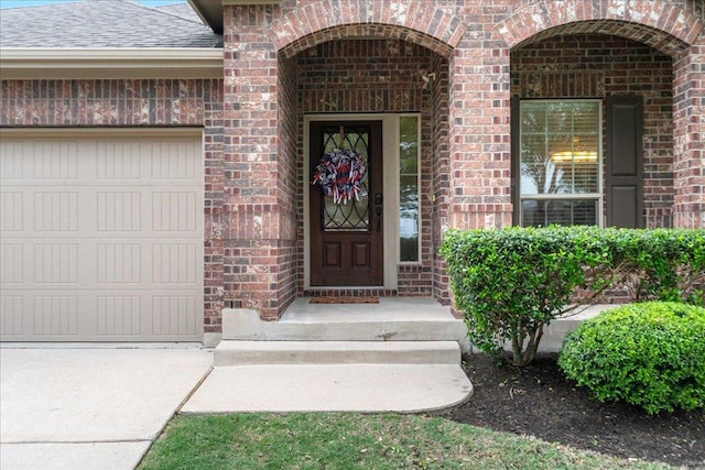 1929 Autumn Run Ln, Round Rock, TX 78665 - property entrance featuring brick siding, a shingled roof, and an attached garage