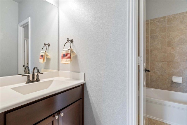 bathroom featuring vanity and washtub / shower combination