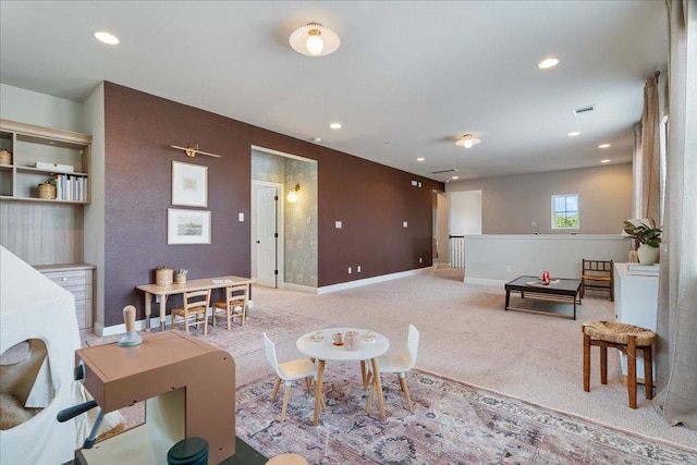 living area with carpet floors, recessed lighting, and baseboards