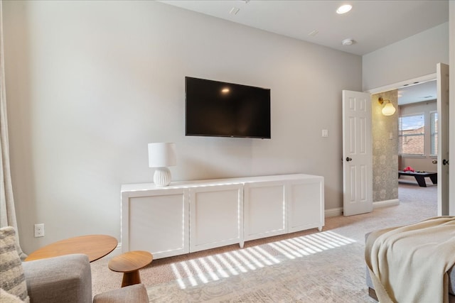 bedroom featuring baseboards and light colored carpet