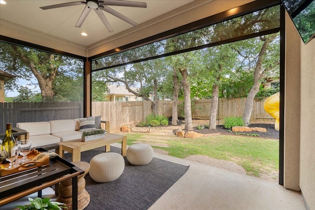 view of patio featuring a fenced backyard, a ceiling fan, and an outdoor living space