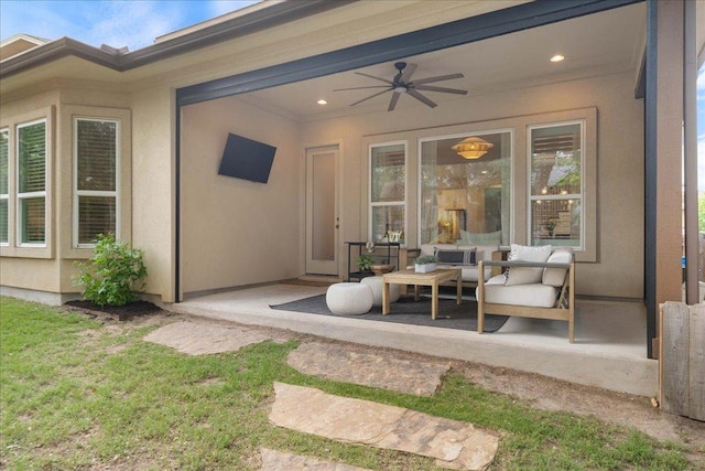 view of patio with ceiling fan and an outdoor living space