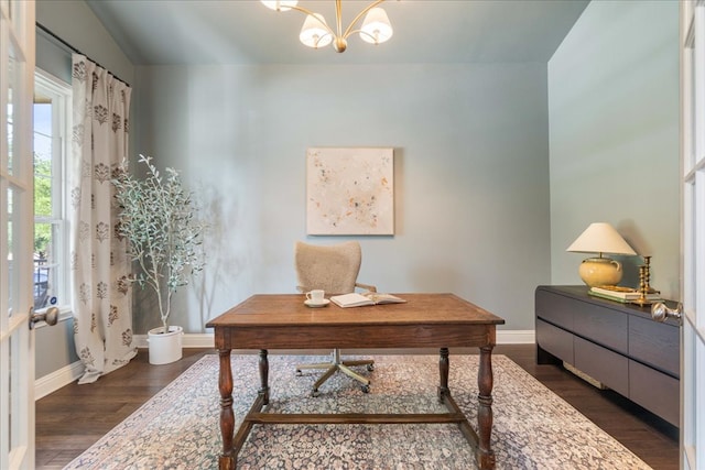 home office featuring an inviting chandelier, baseboards, and dark wood finished floors