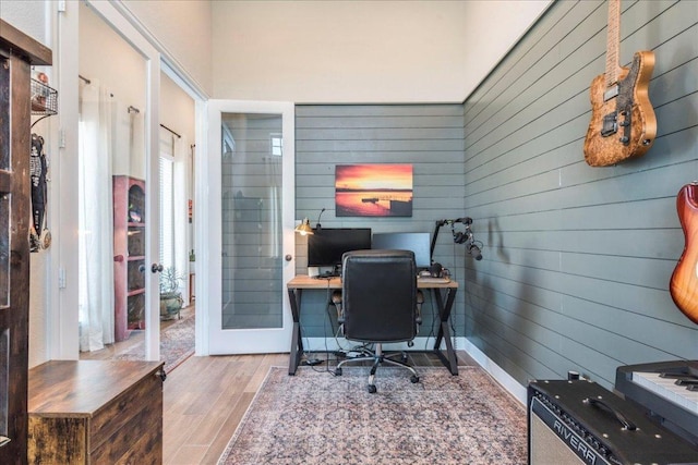 170 Alice Jane Ln, Buda, TX 78610 - office area with wood finished floors, wood walls, and french doors