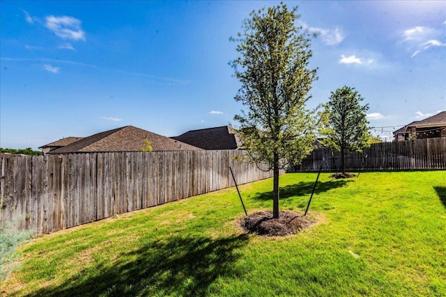 view of yard featuring a fenced backyard
