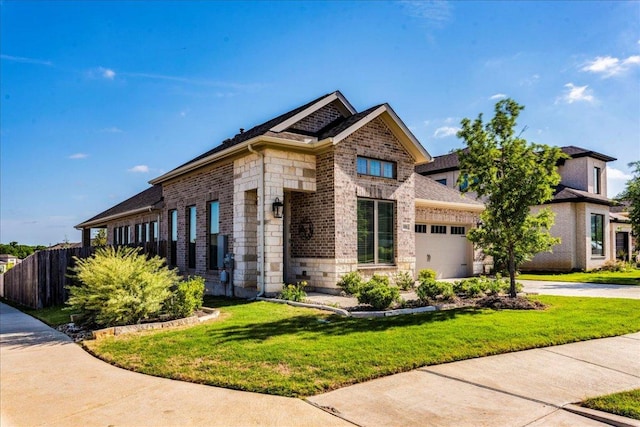 170 Alice Jane Ln, Buda, TX 78610 - view of front of property featuring a garage, stone siding, brick siding, driveway, and roof with shingles