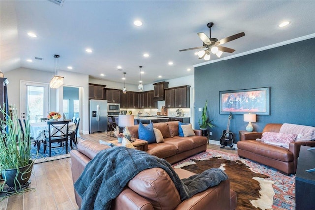 170 Alice Jane Ln, Buda, TX 78610 - living room with light wood-style floors, ceiling fan, recessed lighting, and ornamental molding