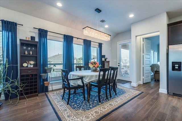 170 Alice Jane Ln, Buda, TX 78610 - dining space with dark wood finished floors, recessed lighting, and a chandelier