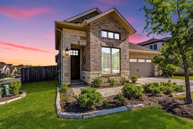 170 Alice Jane Ln, Buda, TX 78610 - view of front of home featuring driveway, a garage, brick siding, and stone siding