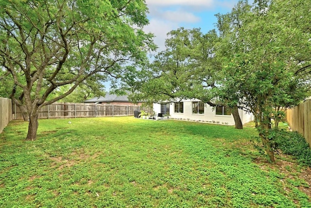 view of yard featuring a fenced backyard