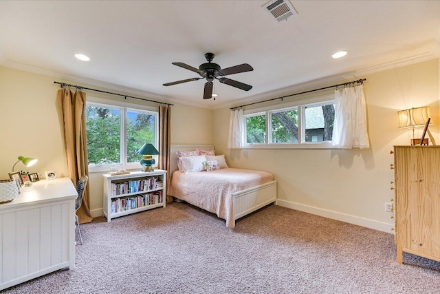 bedroom featuring visible vents, ornamental molding, baseboards, and light colored carpet