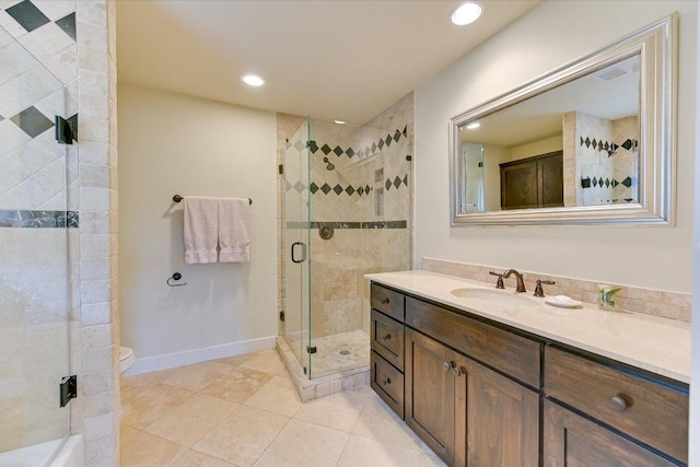 bathroom featuring vanity, recessed lighting, tile patterned floors, and a stall shower