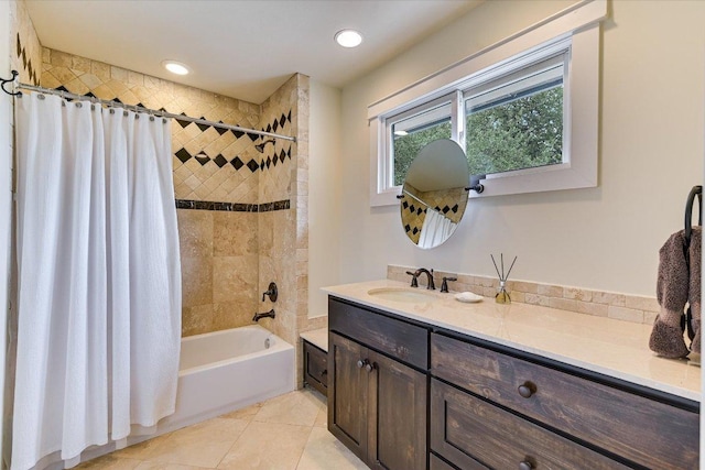 full bath with tile patterned floors, shower / bath combo with shower curtain, vanity, and recessed lighting