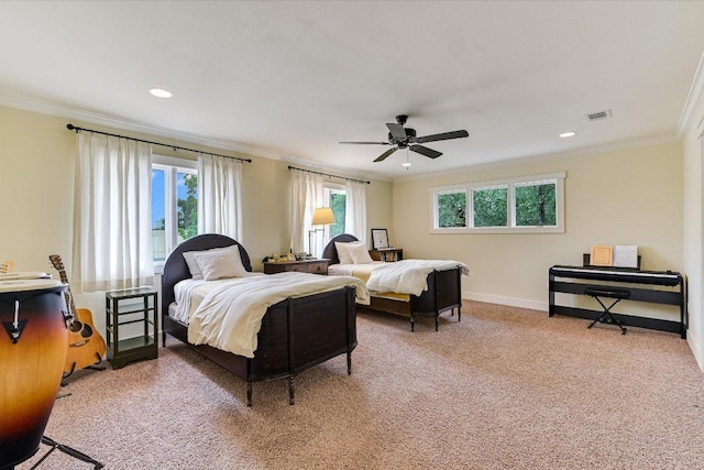 bedroom with crown molding, visible vents, and multiple windows