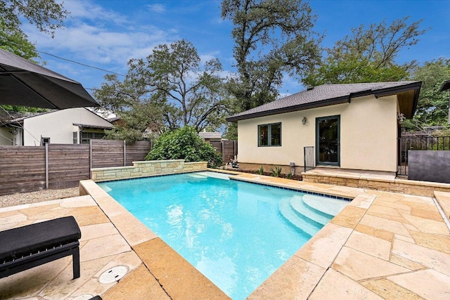 view of pool featuring a fenced in pool, a fenced backyard, and a patio