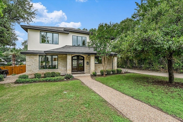 2401 Westover Rd, Austin, TX 78703 - view of front of home featuring stone siding, stucco siding, and roof with shingles