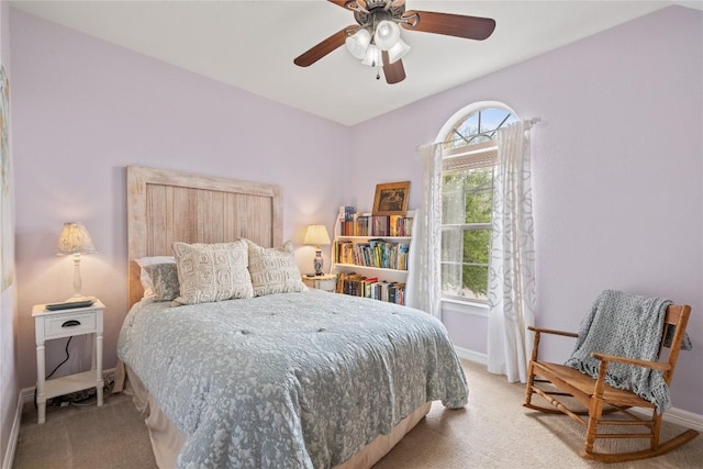 bedroom featuring baseboards, carpet flooring, and a ceiling fan