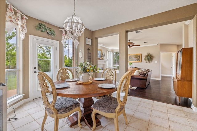100 S Ridge Cir, Georgetown, TX 78628 - dining room with baseboards, a chandelier, light tile patterned floors, and ceiling fan