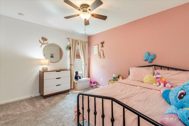 268 Forrest Moon Ln, Kyle, TX 78640 - bedroom with carpet floors, baseboards, and a ceiling fan