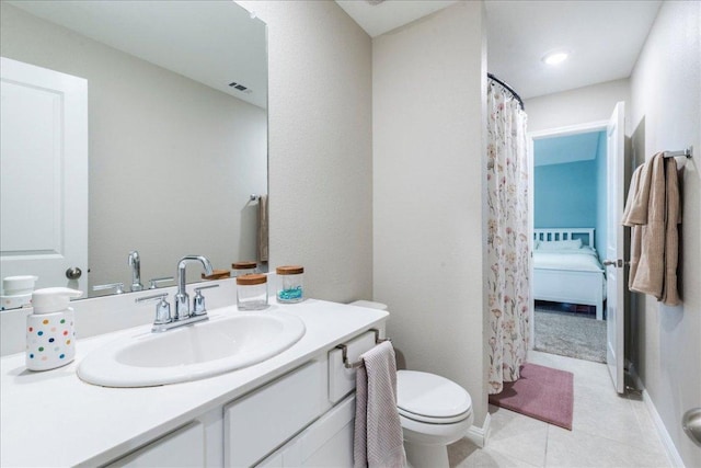 full bathroom featuring vanity, tile patterned flooring, toilet, and curtained shower