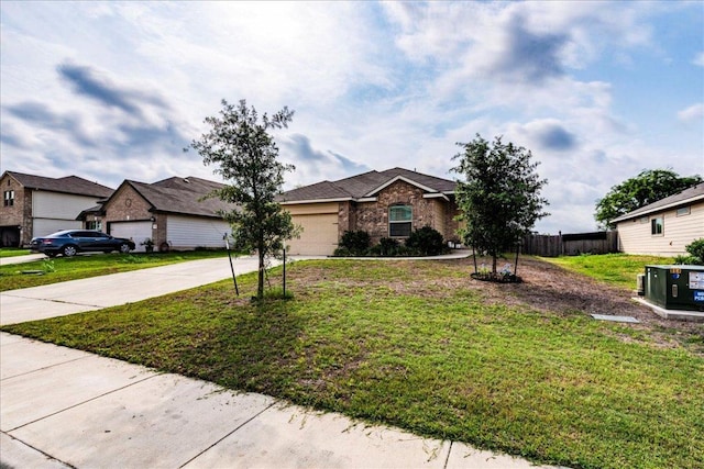 single story home featuring an attached garage, a front lawn, fence, and driveway