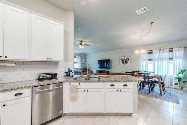 268 Forrest Moon Ln, Kyle, TX 78640 - kitchen featuring stainless steel dishwasher, a sink, a peninsula, white cabinets, and a ceiling fan