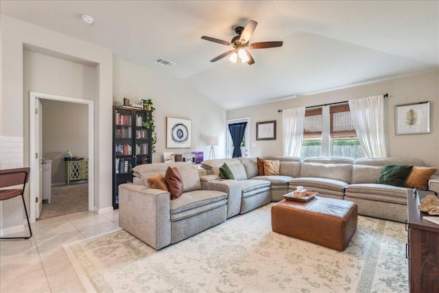268 Forrest Moon Ln, Kyle, TX 78640 - living room with lofted ceiling, light tile patterned flooring, ceiling fan, and baseboards