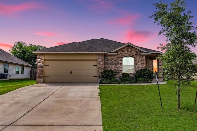 268 Forrest Moon Ln, Kyle, TX 78640 - ranch-style home featuring brick siding, driveway, an attached garage, and a front lawn