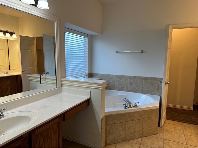 full bath with vanity, tile patterned floors, and a bath