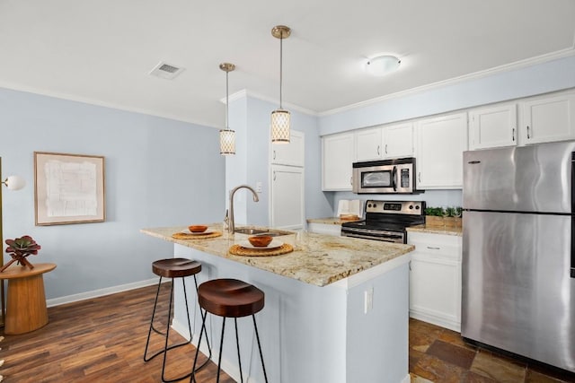 8888 Tallwood Dr Unit 1110, Austin, TX 78759 - kitchen with a sink, ornamental molding, stainless steel appliances, and white cabinetry