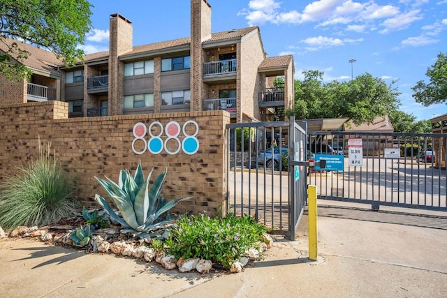 8888 Tallwood Dr Unit 1110, Austin, TX 78759 - exterior space with fence and a gate