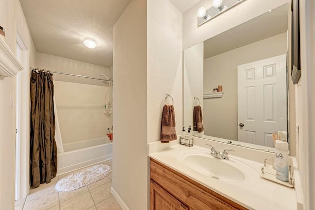 full bath featuring vanity, tile patterned floors, and shower / bath combo