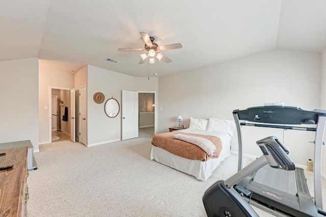 carpeted bedroom featuring visible vents, baseboards, ceiling fan, and vaulted ceiling