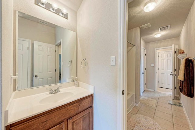 full bath with visible vents, shower / bath combination, tile patterned floors, and vanity