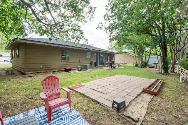 back of property with a lawn, fence, a patio, and cooling unit