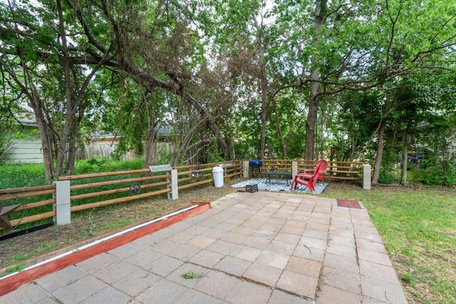 view of patio featuring fence