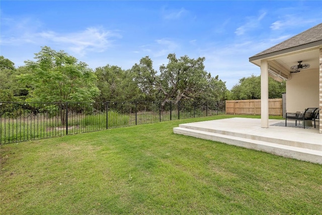 view of yard with a fenced backyard and a patio