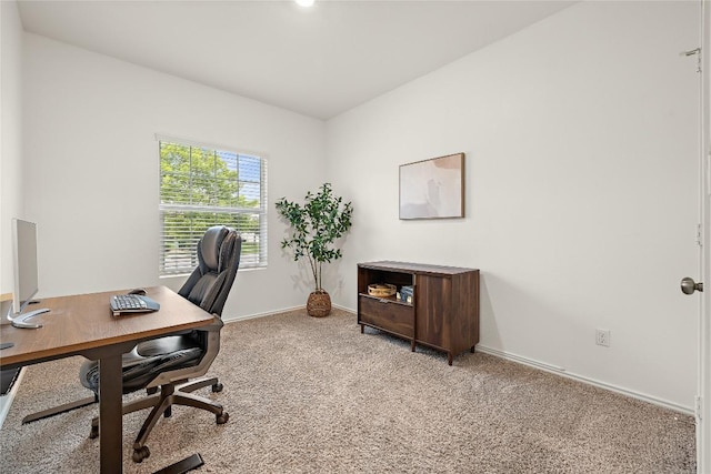 carpeted home office featuring baseboards
