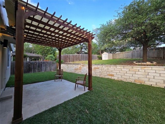 view of yard with a storage shed, an outbuilding, a fenced backyard, and a patio area