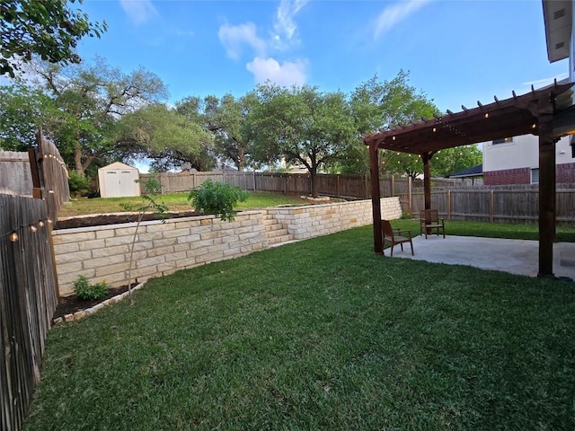 view of yard featuring an outbuilding, a fenced backyard, a patio area, and a storage unit