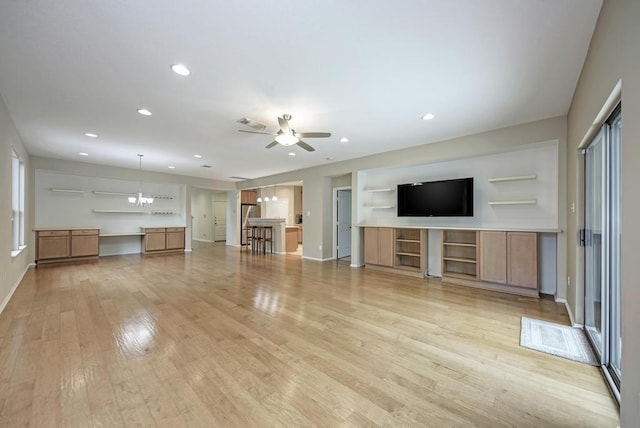 2119 Howell Mountain Dr, Cedar Park, TX 78613 - unfurnished living room with light wood-style flooring, a ceiling fan, recessed lighting, and healthy amount of natural light