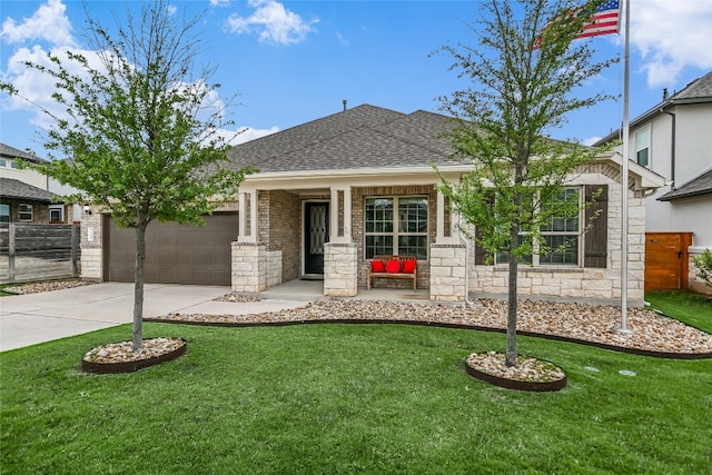 single story home with roof with shingles, an attached garage, driveway, and a front lawn
