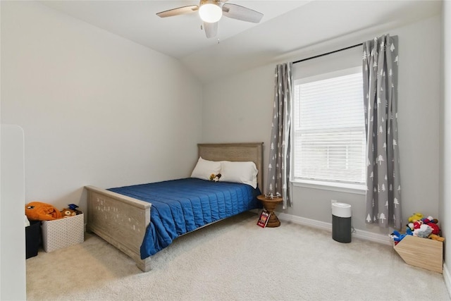 bedroom with baseboards, a ceiling fan, carpet flooring, and lofted ceiling
