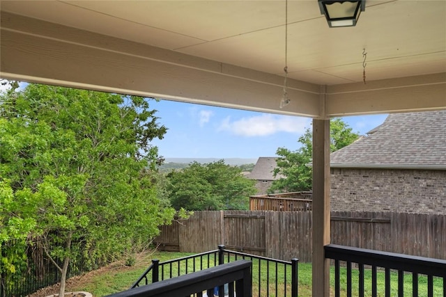 exterior space with a fenced backyard and a lawn
