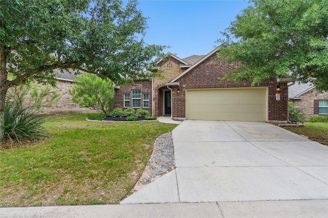 view of front facade with a garage, concrete driveway, a front yard, and brick siding