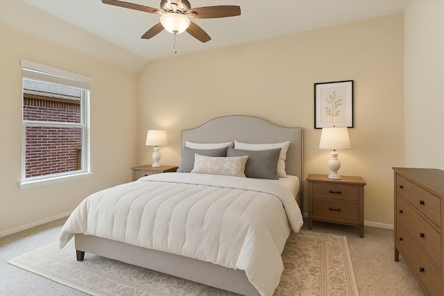bedroom with a ceiling fan, baseboards, light colored carpet, and lofted ceiling