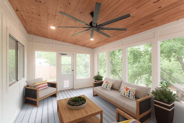 sunroom with ceiling fan, a deck, vaulted ceiling, wooden ceiling, and wood-type flooring