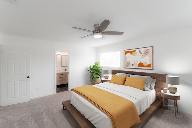 bedroom with baseboards, carpet flooring, and ensuite bath