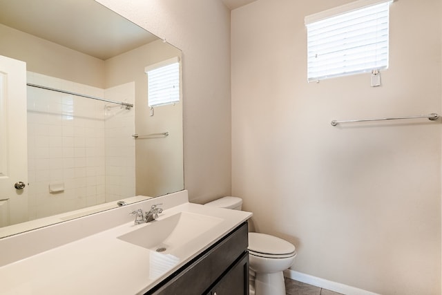 bathroom with toilet, tile patterned floors, walk in shower, and vanity